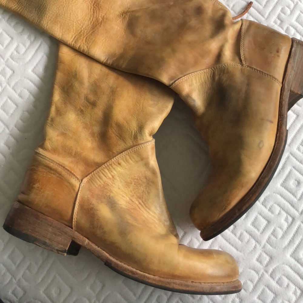 Tan distressed leather knee high boots